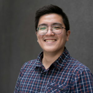 a-man-with-glasses-smiling-for-the-camera