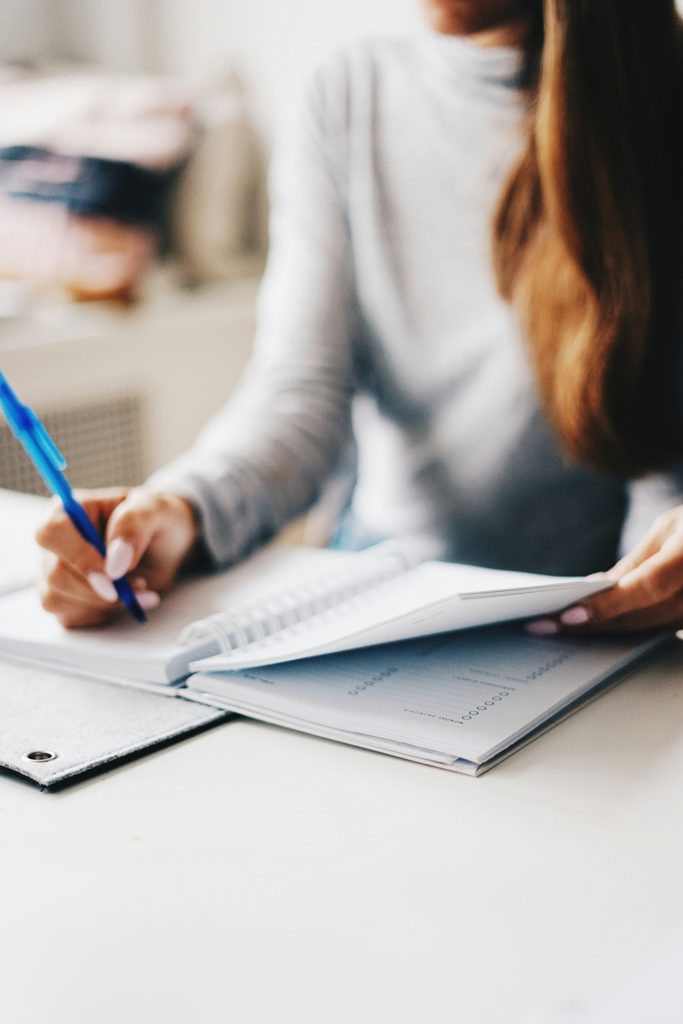 a person working on a notepad